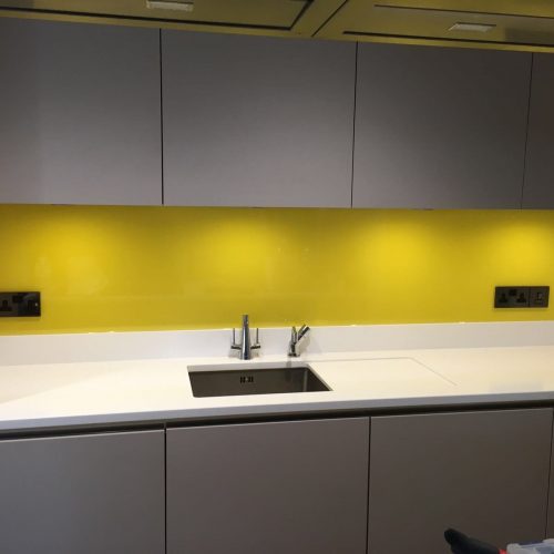 Yellow splashbacks with grey cupboards