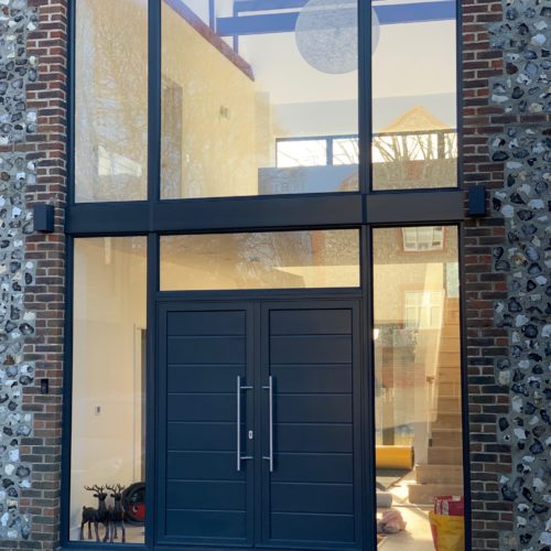 Aluminium front double doors with frames above